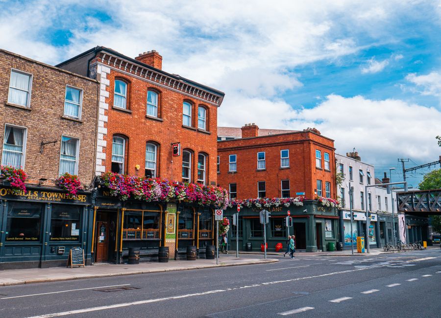Vibrant scene of historic buildings and street life in Dublin, Ireland.
