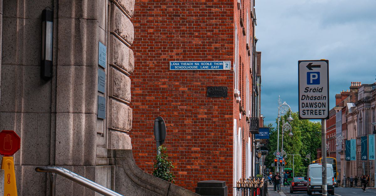 Vibrant street scene at Dawson Street, Dublin with visible signage and architectural elements.