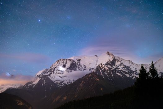 Breathtaking view of Mont Blanc under a starry night sky in Chamonix, France.