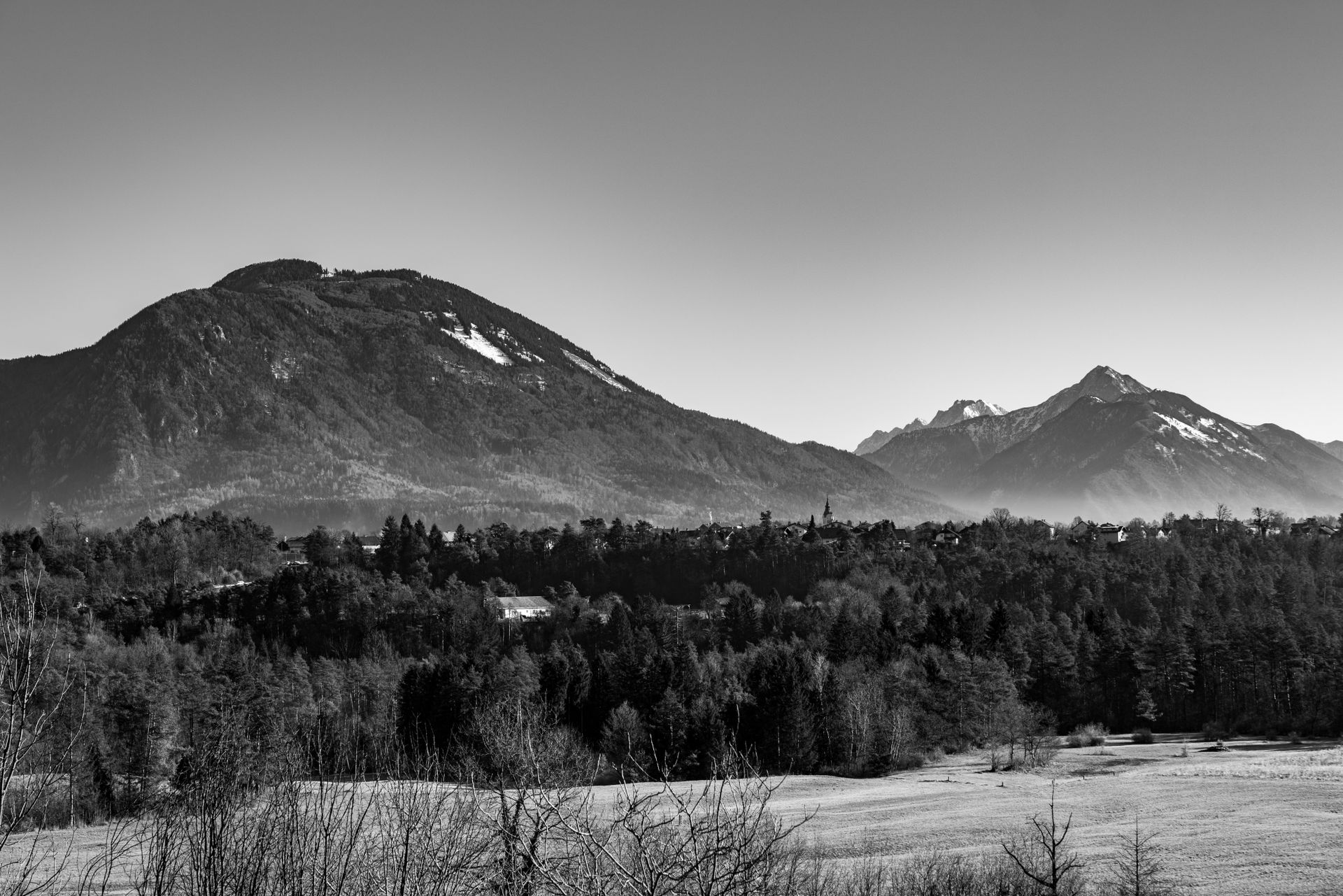 Stunning black and white view of mountains near Bled, Slovenia showcasing natural beauty.
