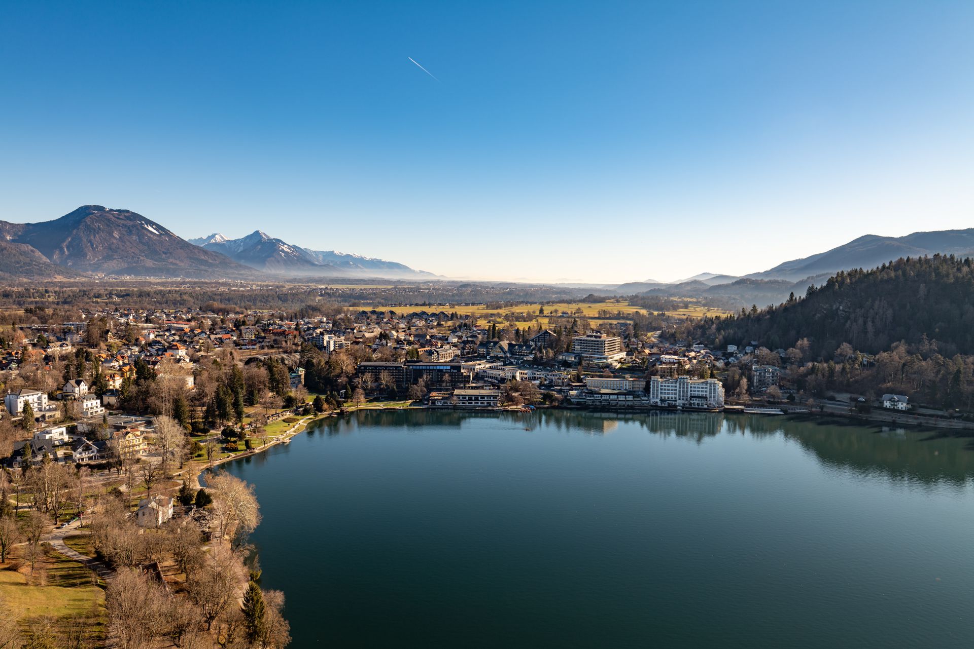 A stunning aerial view of Lake Bled with mountains and a serene landscape in Slovenia.