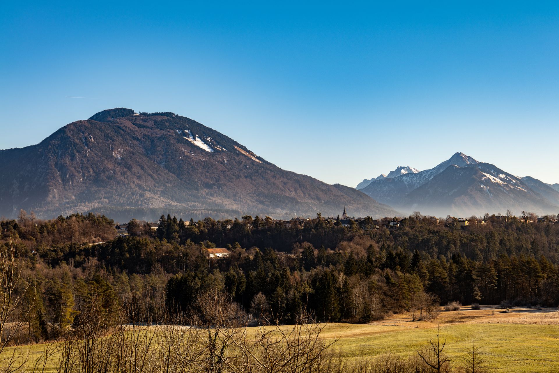 Scenic mountain landscape of Bled with clear skies and lush greenery, Slovenia.
