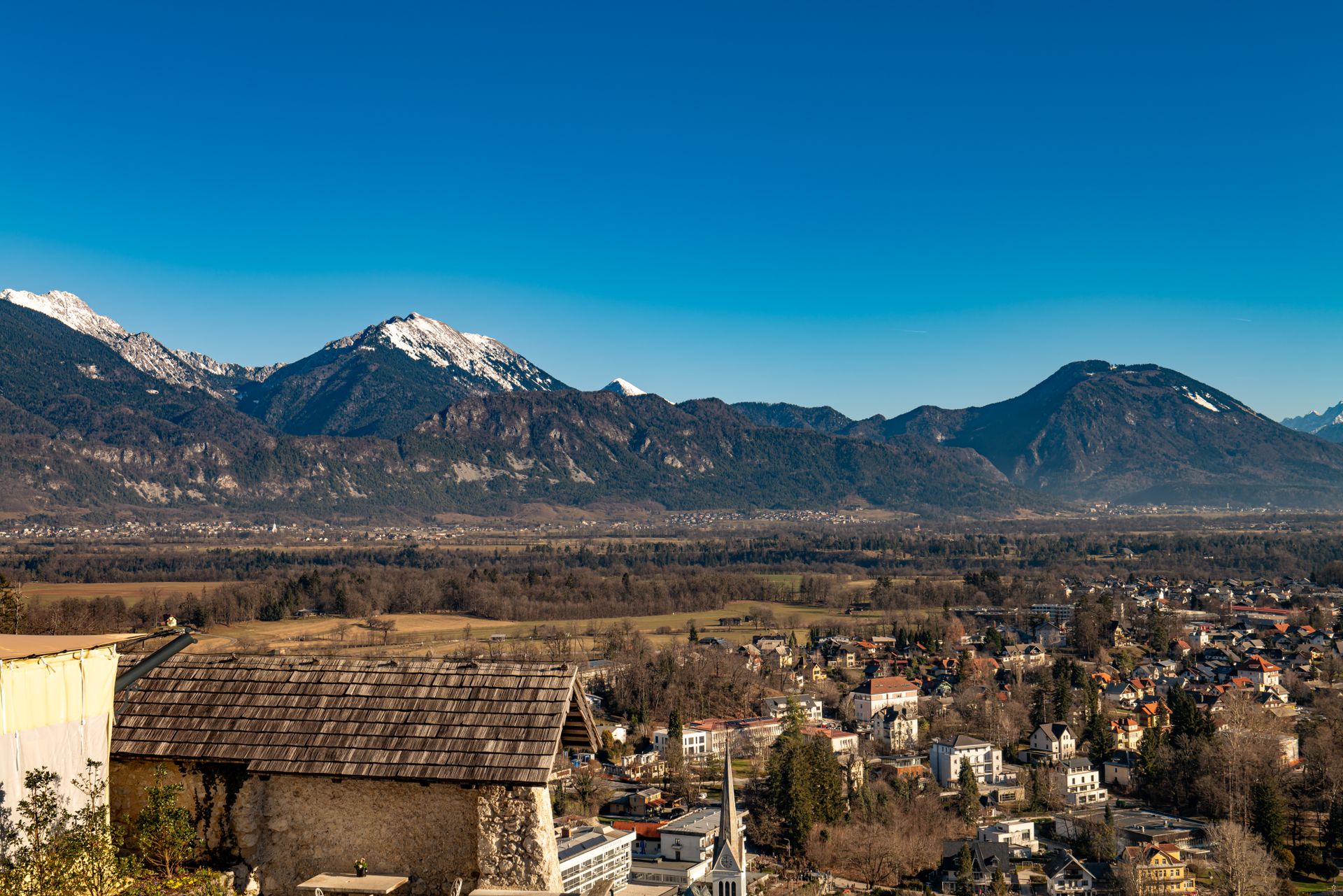 Stunning landscape of Bled, Slovenia framed by the Julian Alps in clear weather.