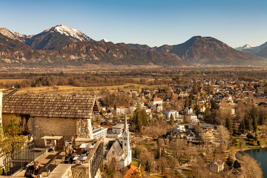 Explore the picturesque Bled with stunning mountains in the backdrop. Ideal for travel and nature lovers.