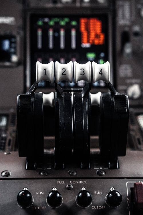 Pilot Throttle Control Close-up of Aircraft Throttle in Cockpit · Free Stock Photo