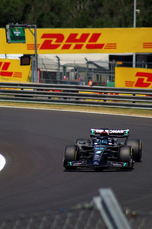High-Speed Formula 1 Racing Action on Track · Free Stock Photo