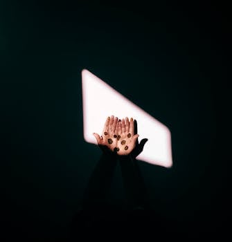 Outstretched hands with coins, illuminated by dramatic lighting, symbolizing wealth and hope.