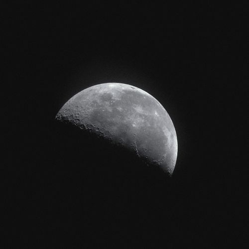 Free Captivating image of the half moon illuminated against a dark night sky. Stock Photo