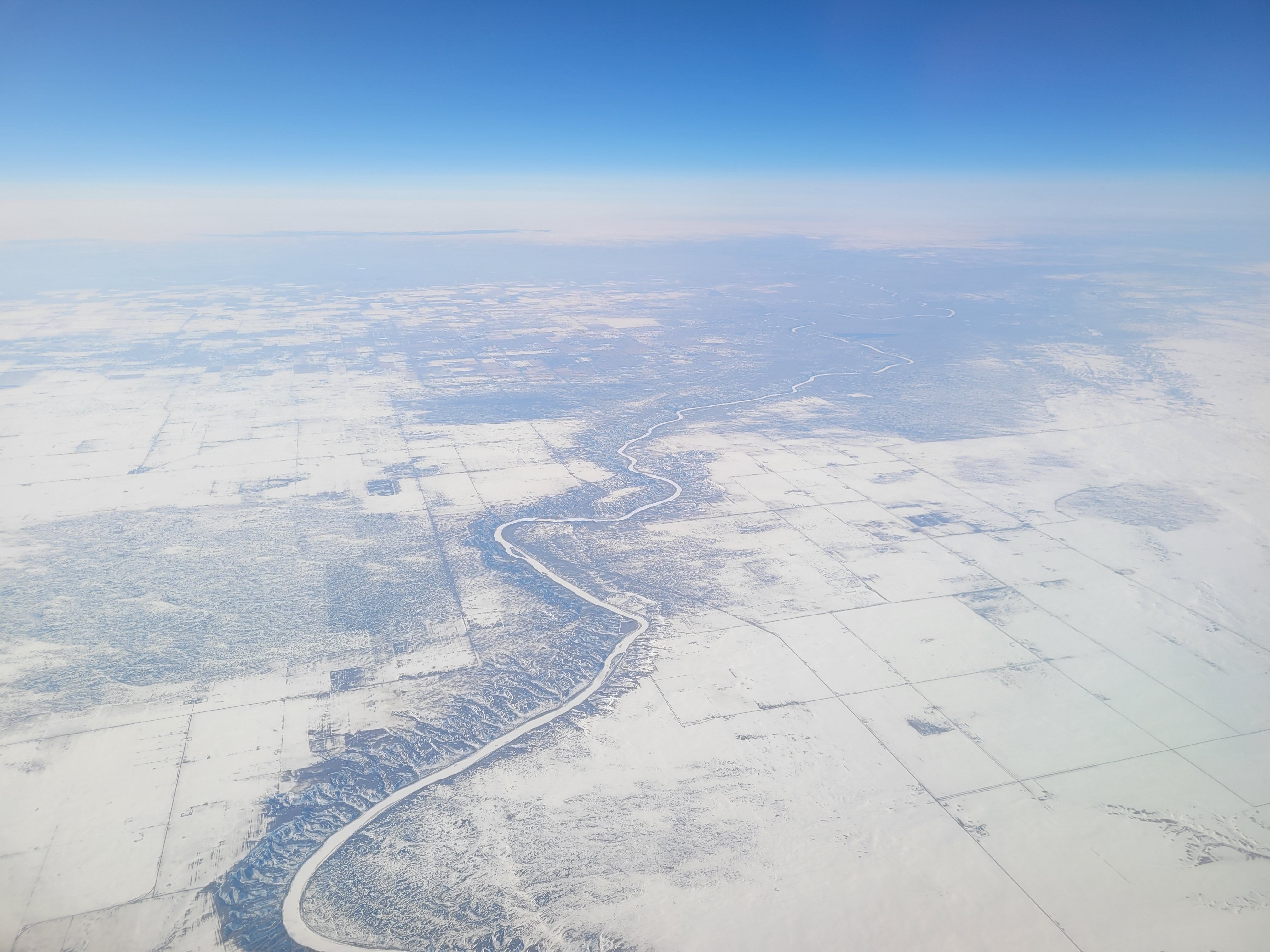 Aerial View of Snow-Covered Landscape in Winter · Free Stock Photo