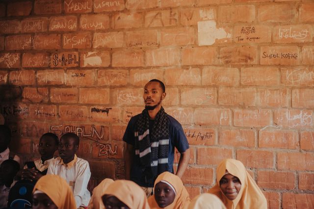 CBC Report Cards Are Eating Teacher Time in Kenyan Schools — Here's the Fix — African teacher and students in a classroom setting