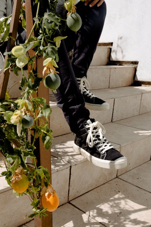 Person Sitting on Stairs