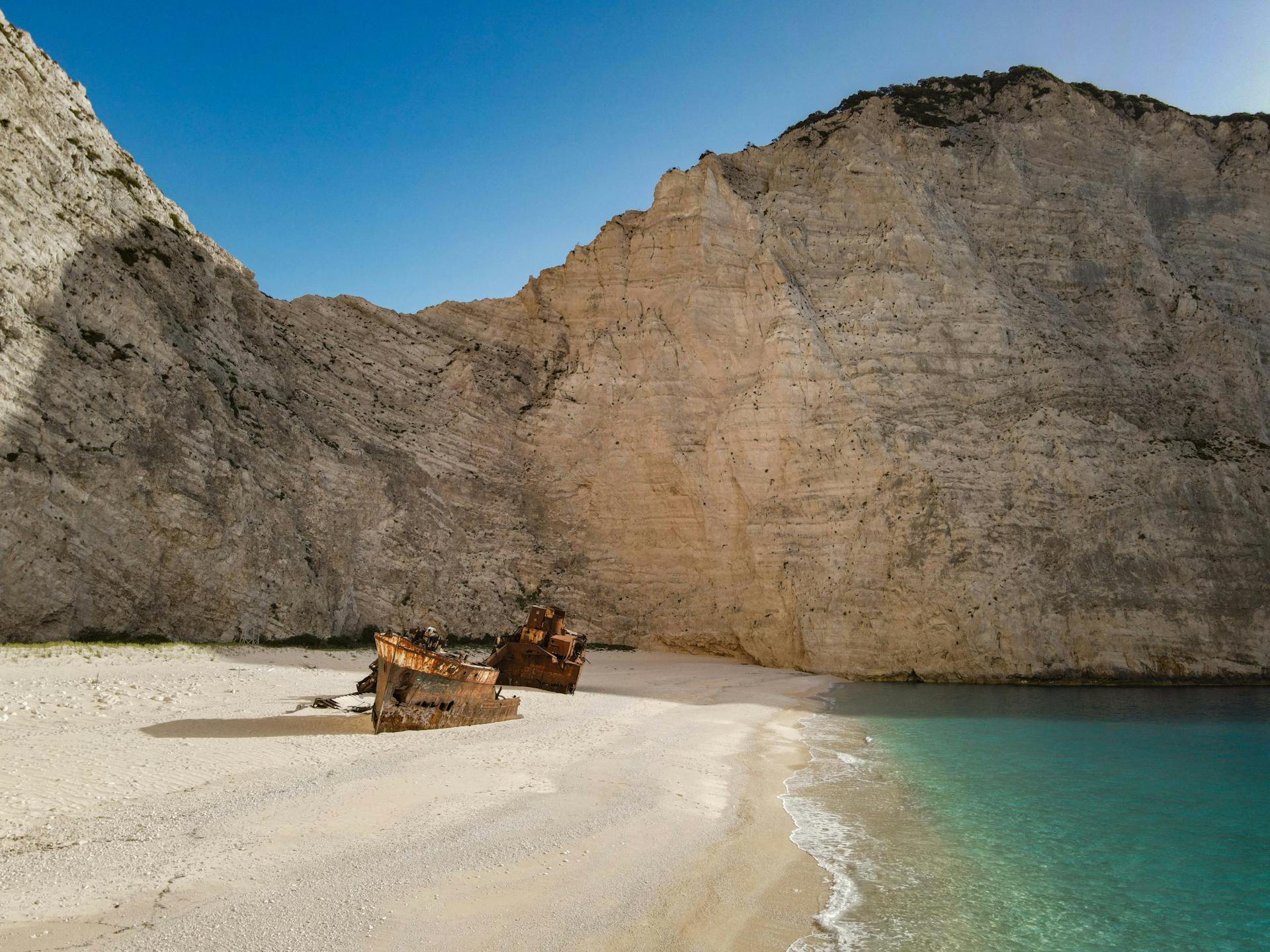 Iconic shipwreck at Navagio Beach, Zakynthos. Stunning cliffs and turquoise sea highlight this breathtaking landscape.
