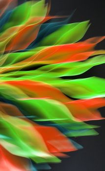 Dynamic abstract art with flowing green, red, and blue colors on a black background.