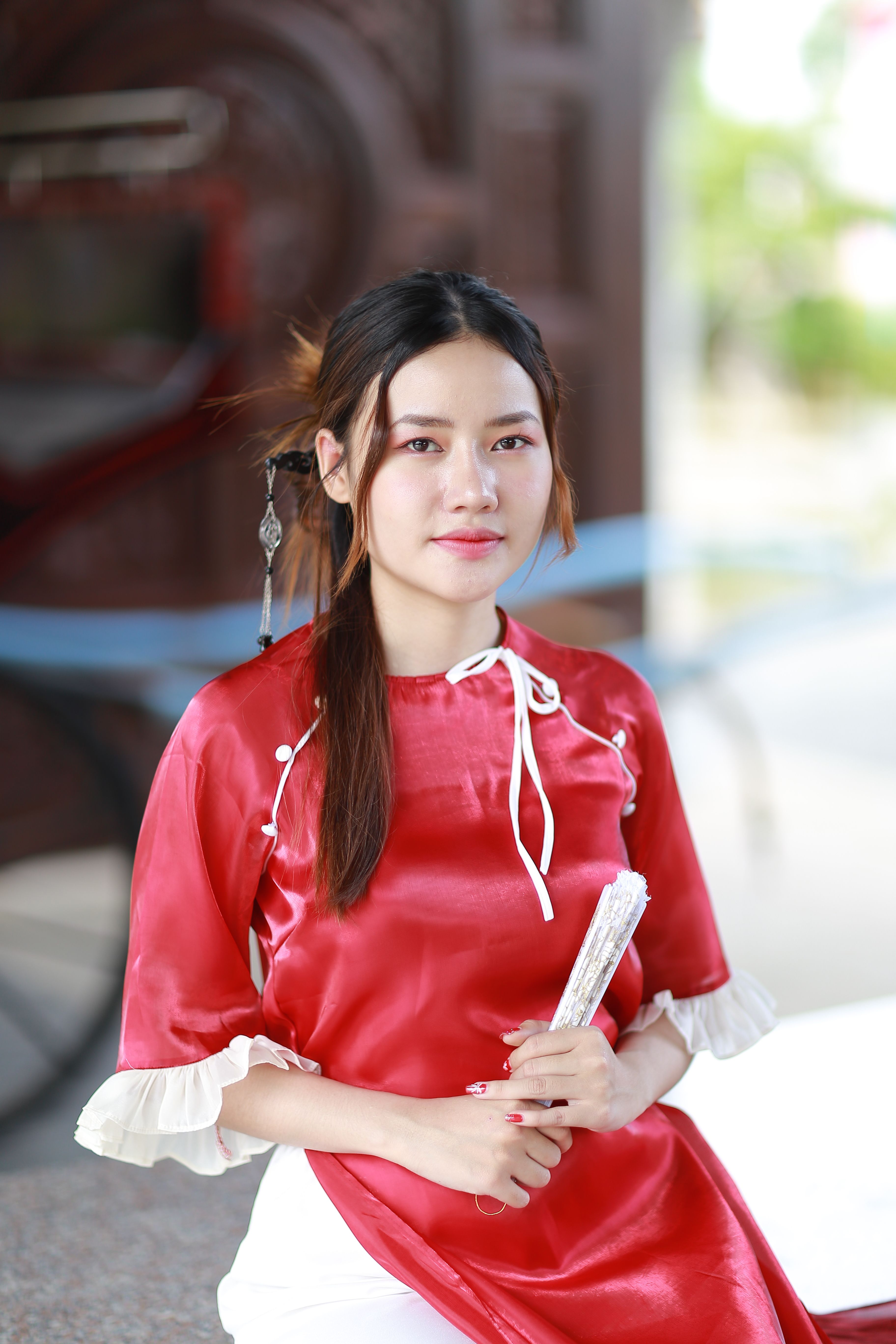 Young Woman in Traditional Red Dress Holding Fan · Free Stock Photo