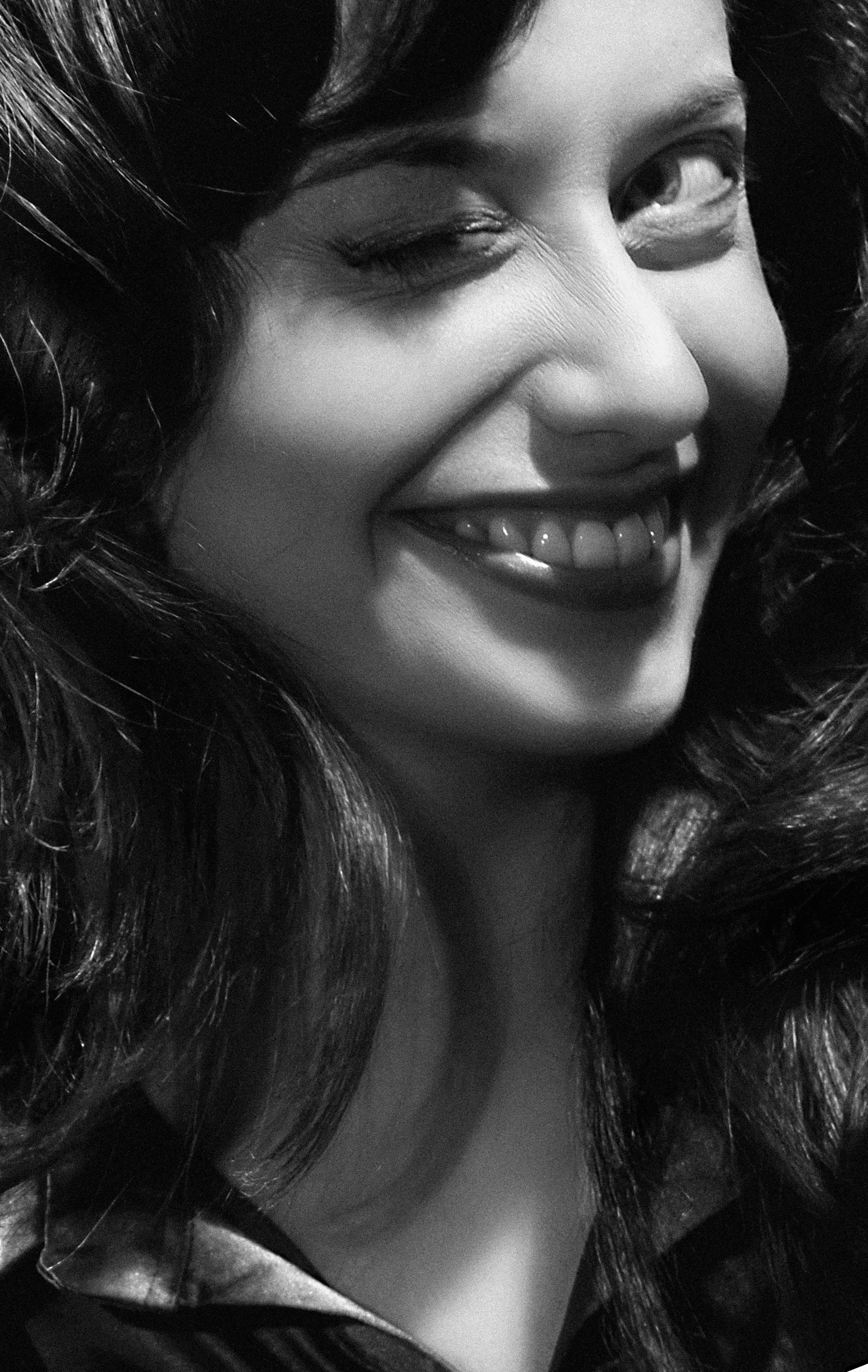 Black and White Portrait of a Smiling Woman · Free Stock Photo