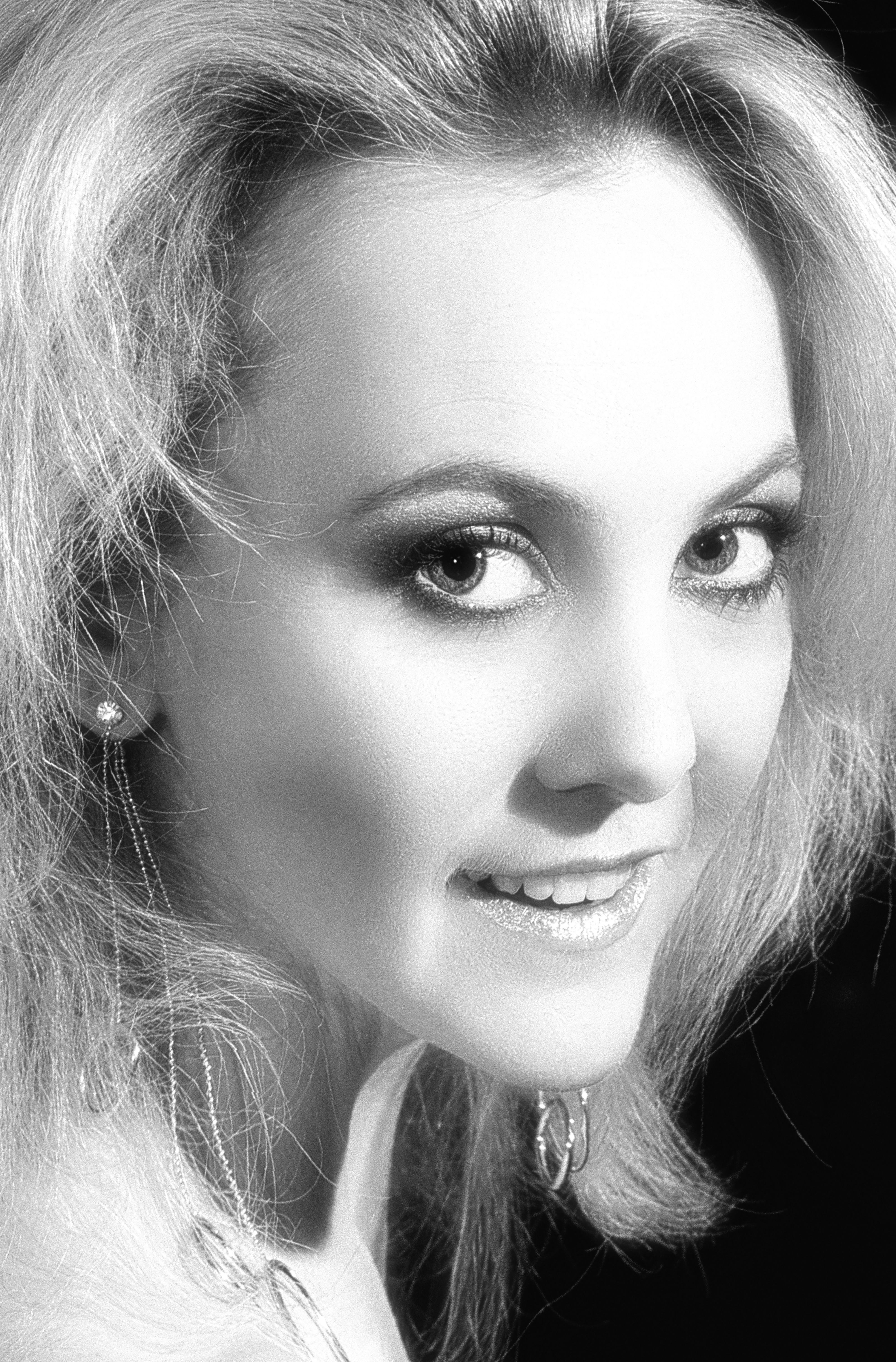 Striking black and white portrait capturing a woman's elegance and beauty.