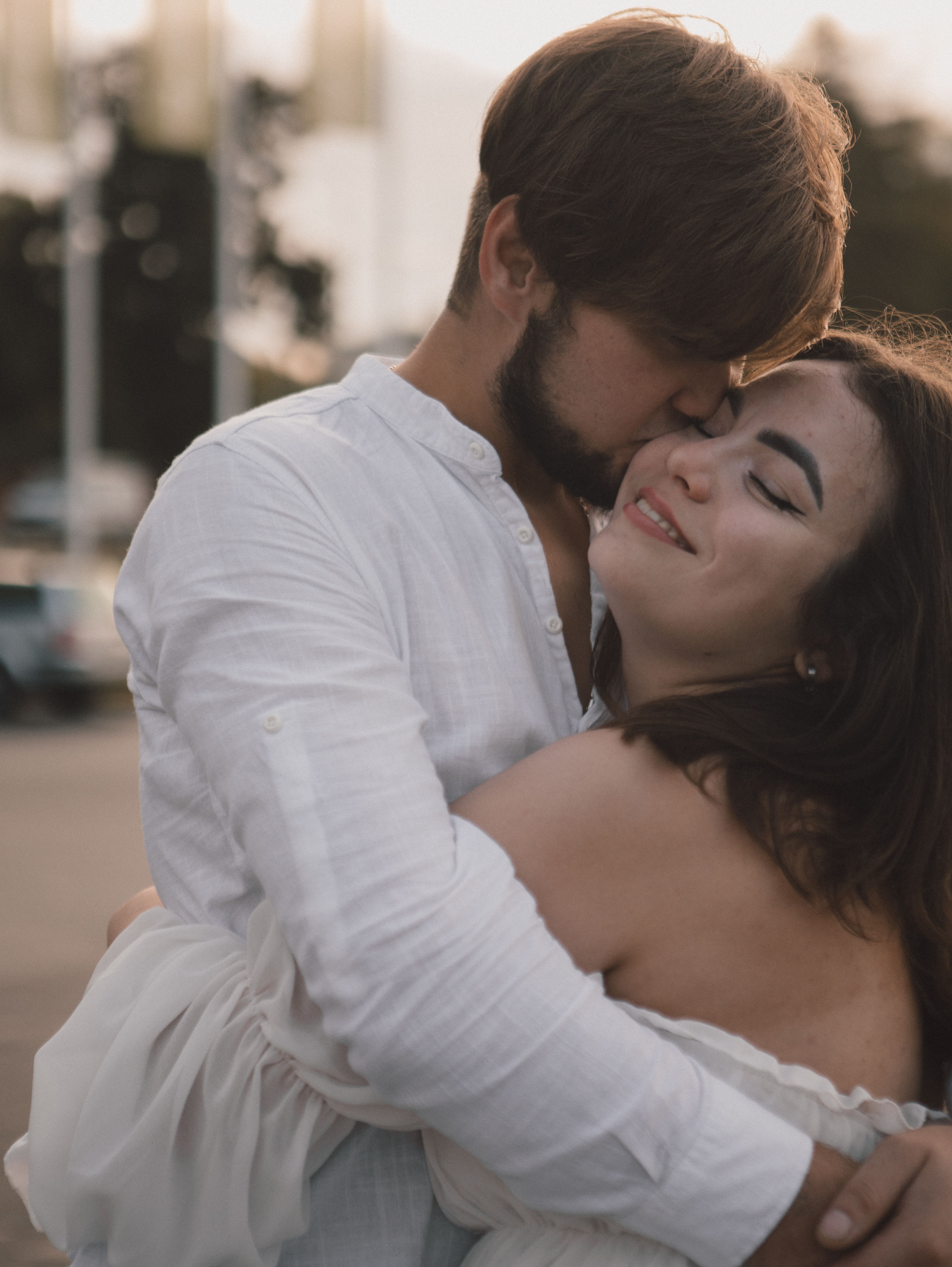 Romantic Couple Embrace at Sunset Outdoors · Free Stock Photo