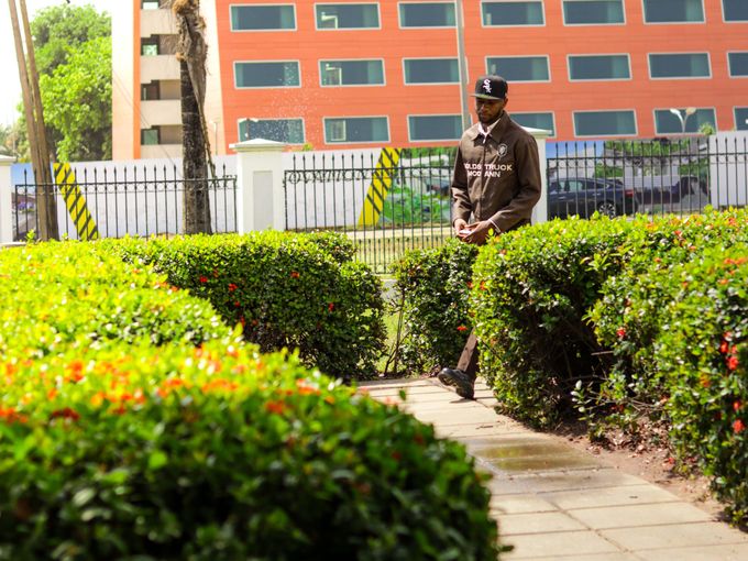 Uniformed security guard patrolling the grounds of an office building