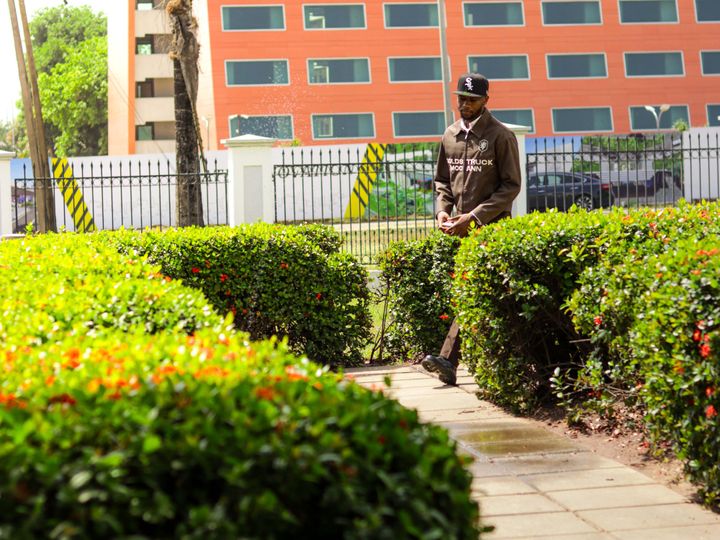 Uniformed security guard patrolling the grounds of an office building