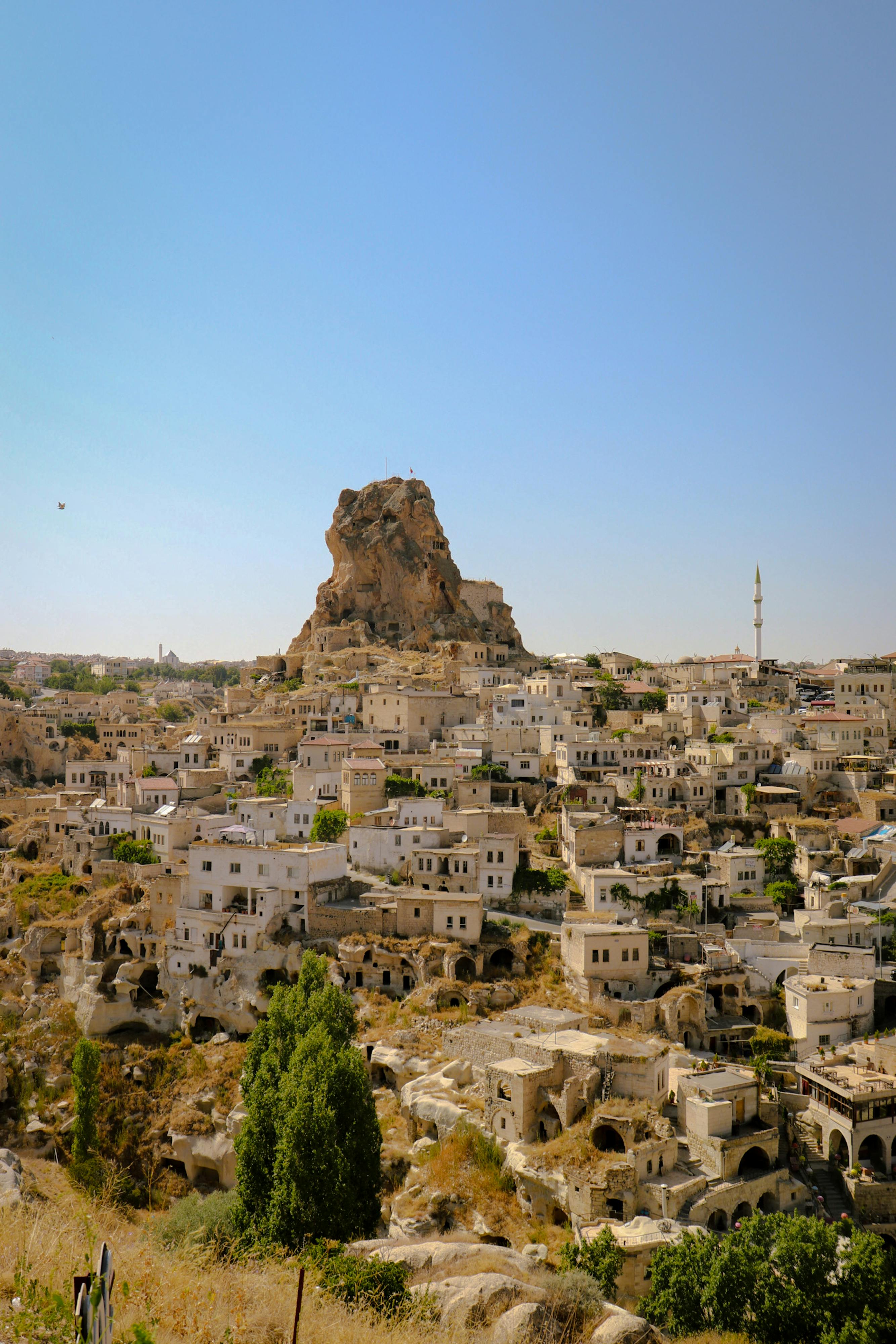 Explore the enchanting landscape of Uçhisar Castle in Cappadocia, showcasing unique rock formations and historic architecture.