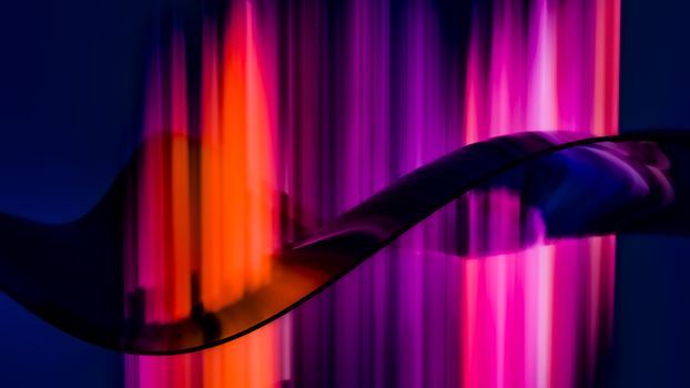 Dynamic abstract art with vibrant light waves in pink and orange hues.