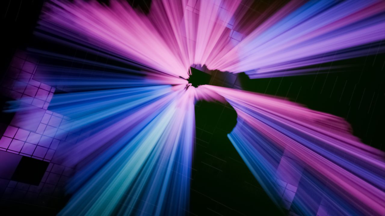 dynamic abstract image featuring vibrant pink and blue light streaks r