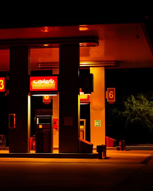 Free A vibrant neon-lit gas station in Marrakesh, Morocco, showcasing a retro aesthetic. Stock Photo