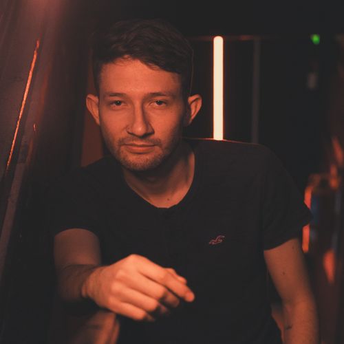 Free Casual portrait of a man in a trendy Buenos Aires bar with warm lighting. Stock Photo