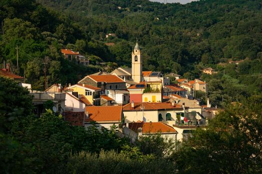 Charming village scene in Gameragna, Liguria, showcasing Italian hillside architecture at sunset.