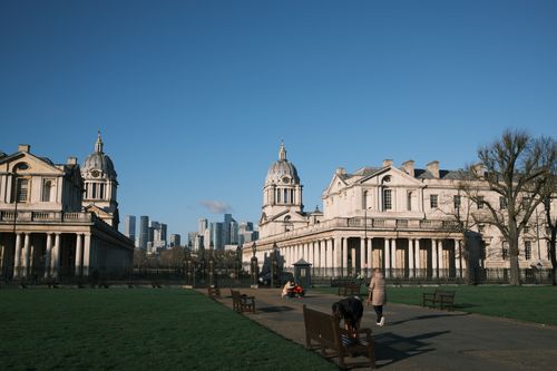 Free Classic Greenwich architecture with modern high-rise skyline on a sunny day. Stock Photo