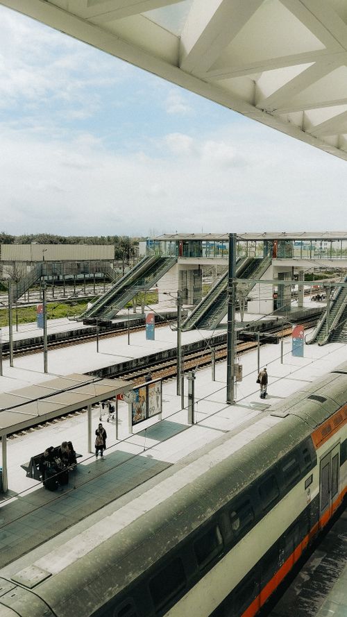 Free View of a bustling train station in Rabat, showcasing modern design and vibrant urban life. Stock Photo