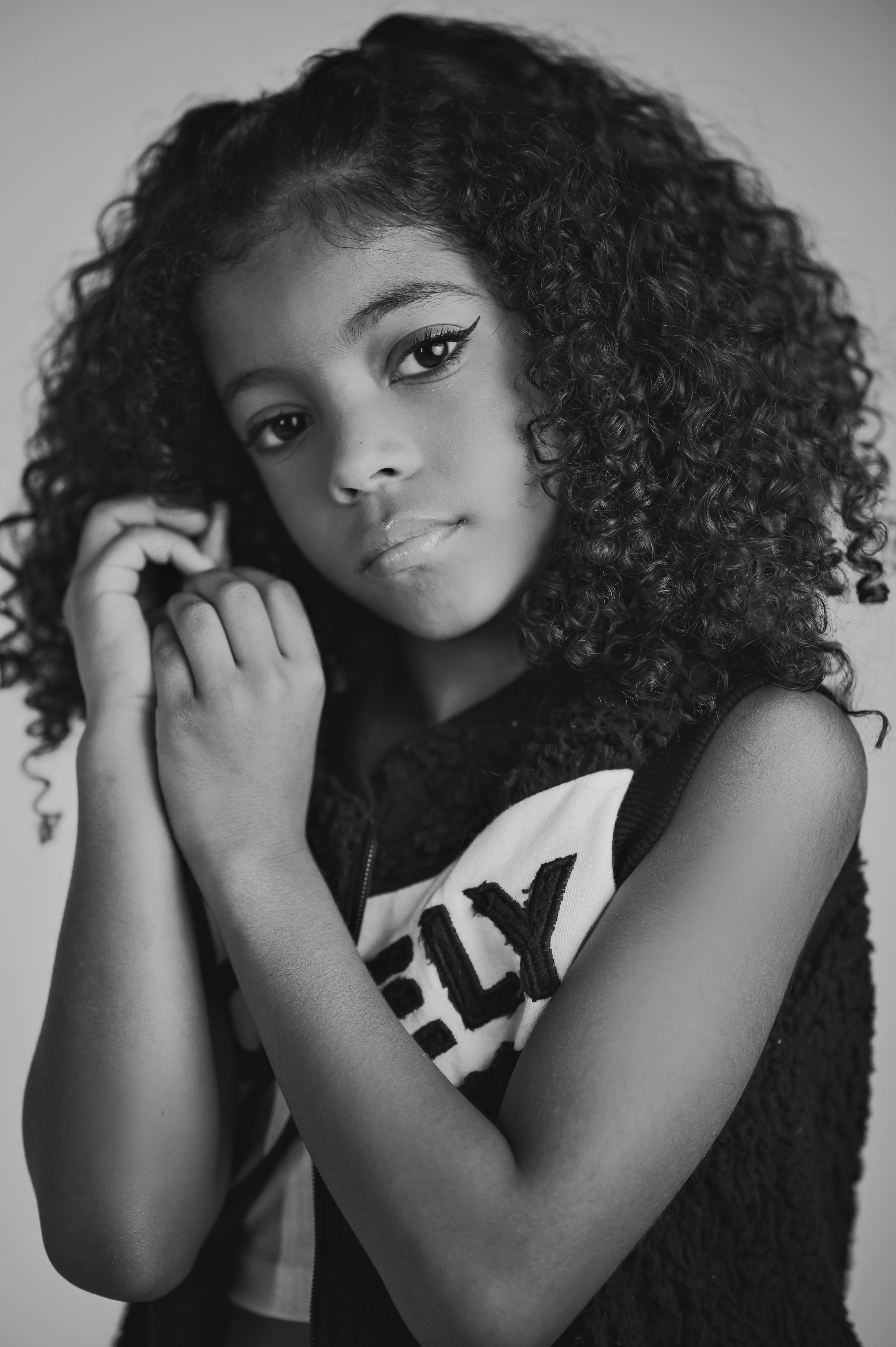 Portrait of a Young Girl with Curly Hair · Free Stock Photo