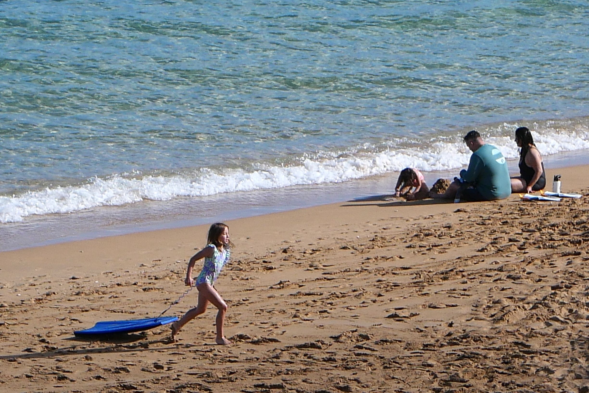 Beachgoers enjoying the sand on Kāʻanapali Beach