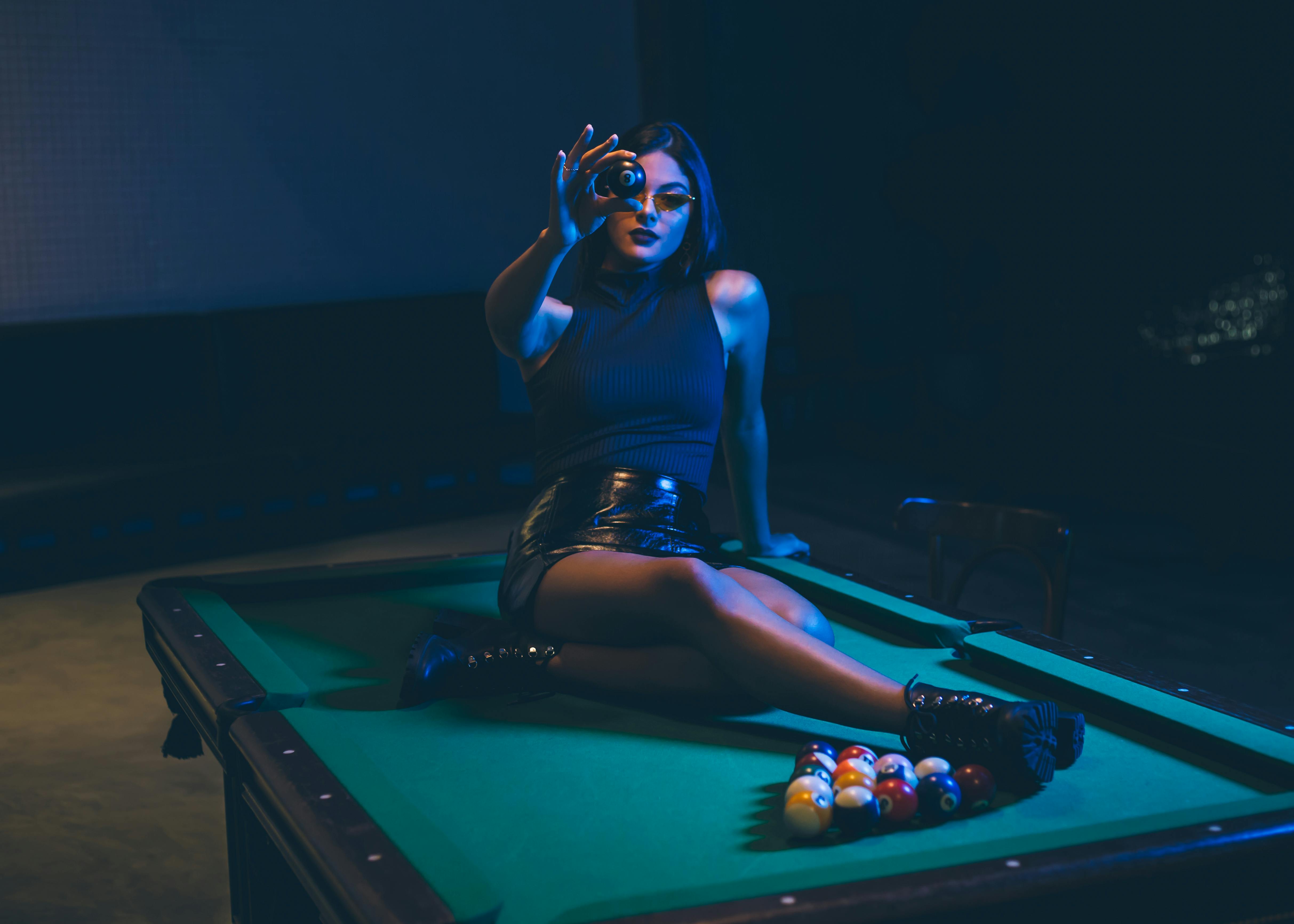 On the pool table.