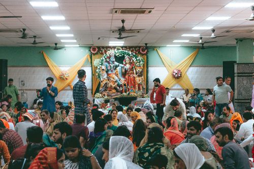 Free A joyful gathering celebrating a Hindu festival with colorful decorations and traditional attire in Delhi, India. Stock Photo