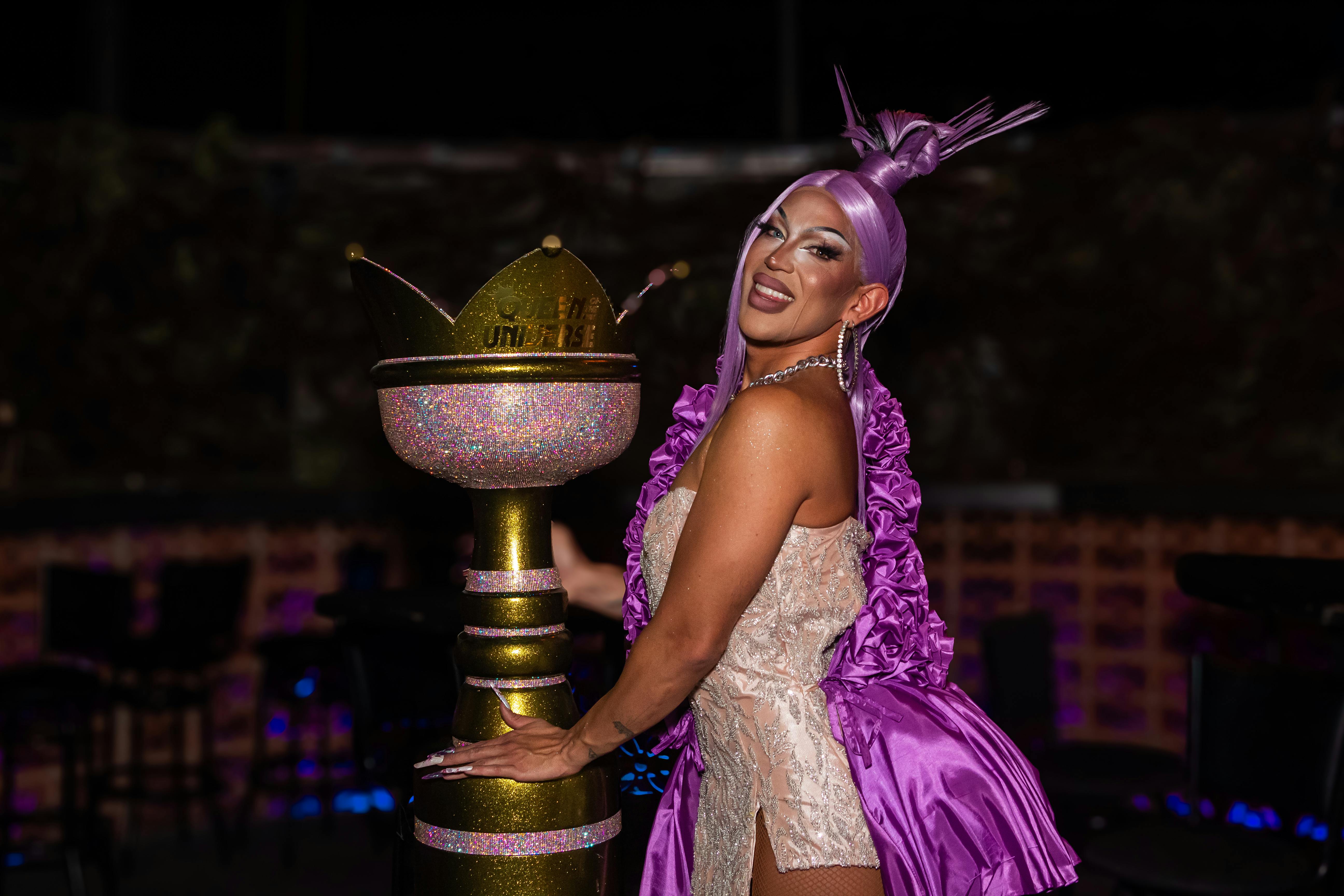 Megan Moroney accepting an award on stage -  megan moroney