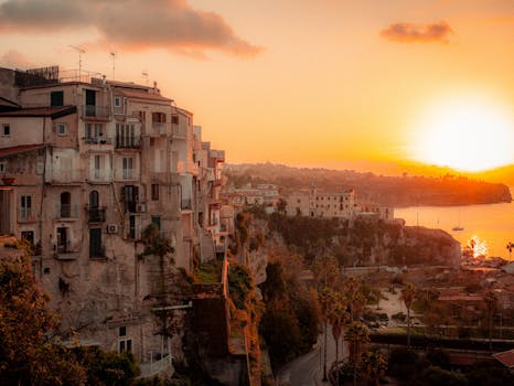 Beautiful coastal architecture at sunset in Calabria, Italy, capturing vibrant hues and serene seascape.