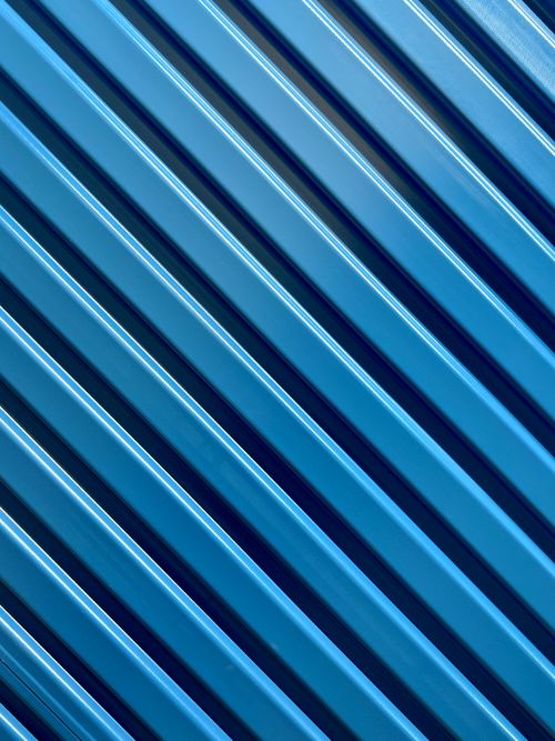 Free Close-up of blue diagonal lines creating an abstract textured pattern. Stock Photo
