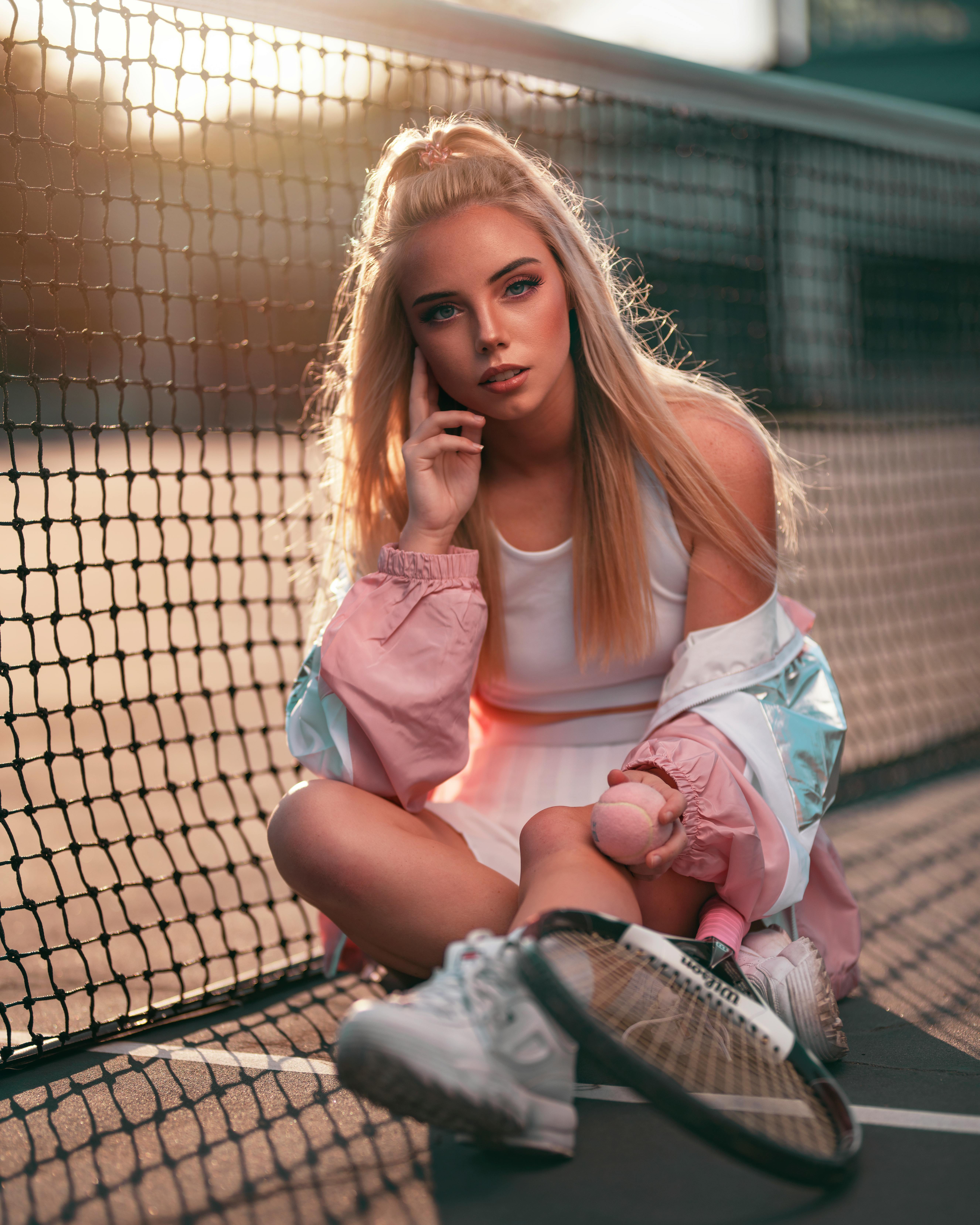 photo of woman sitting on ground