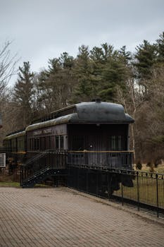 A vintage Canadian Pacific train car nestled in an Ontario forest, showcasing historic travel charm.