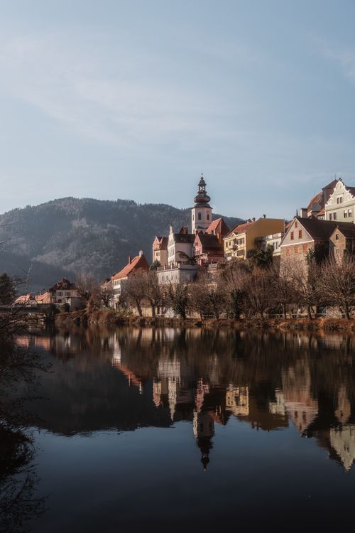 Free Charming reflection of Frohnleiten village in Styria, Austria, captured on a serene day. Stock Photo