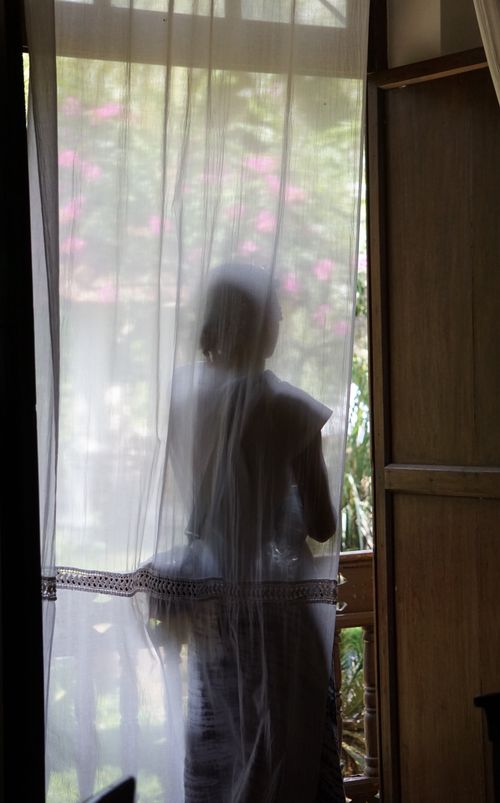 Free    Girl behind shear curtains                             Stock Photo