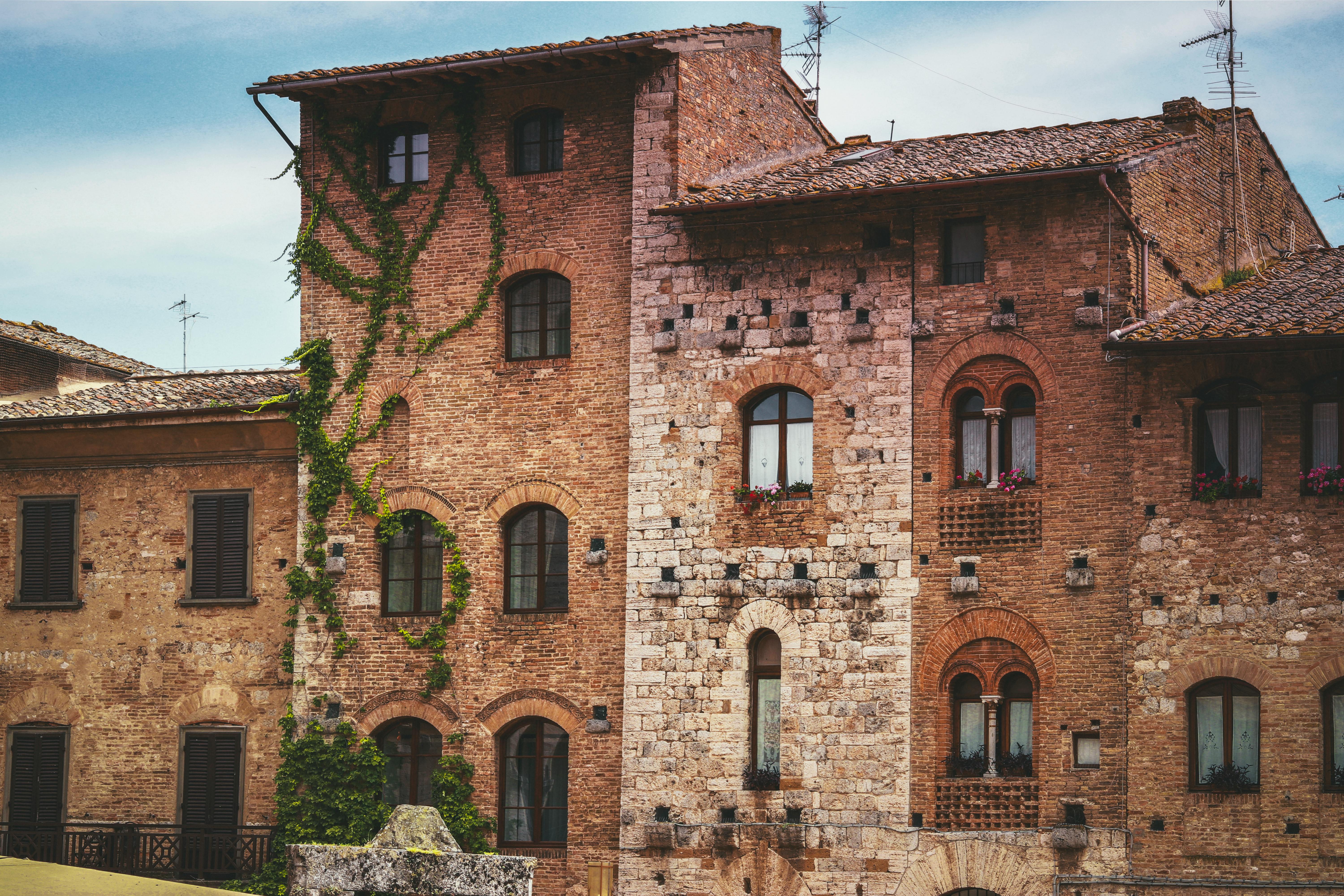 Historic stone buildings in San Gimignano, showcasing medieval architecture and charm.