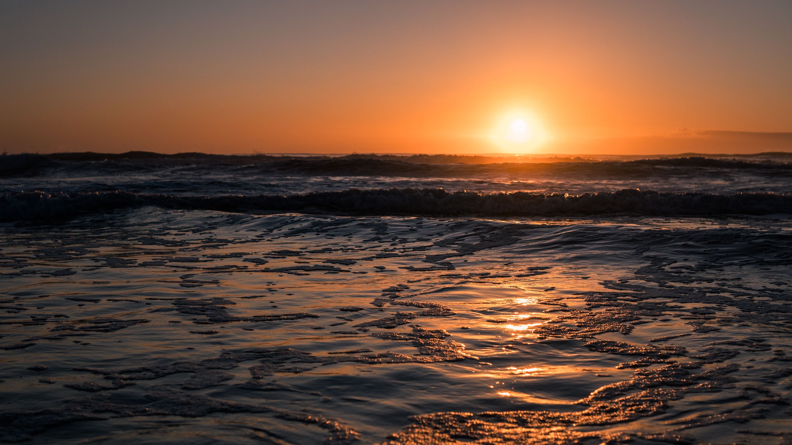Sunset Over Tranquil Ocean Waves · Free Stock Photo