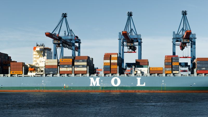 Container ship docked at a terminal