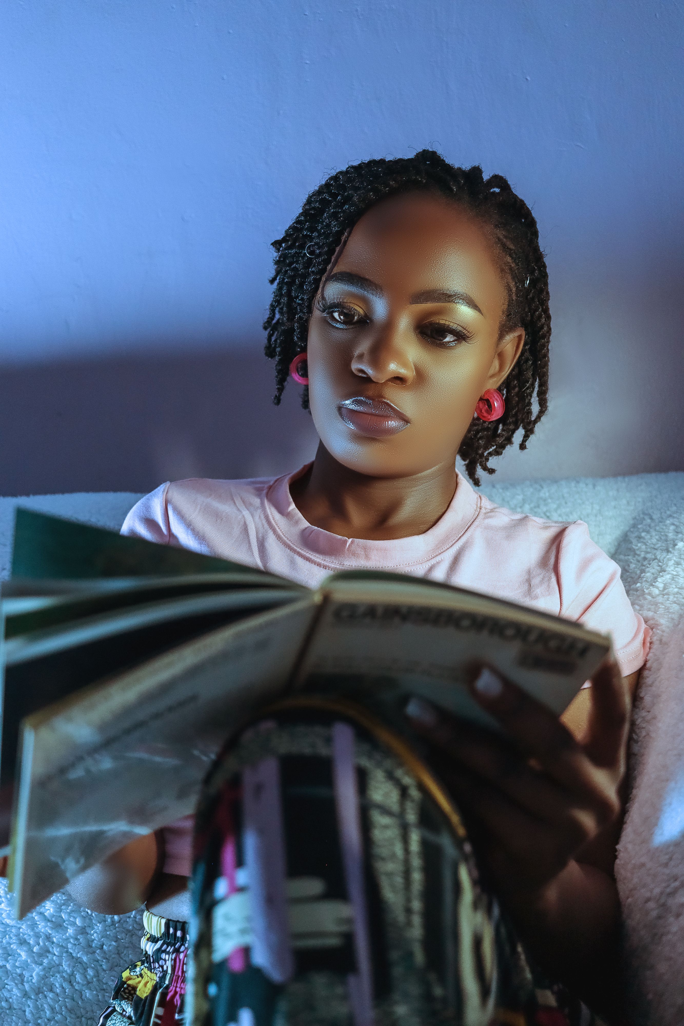 Young Woman Reading a Book Indoors · Free Stock Photo