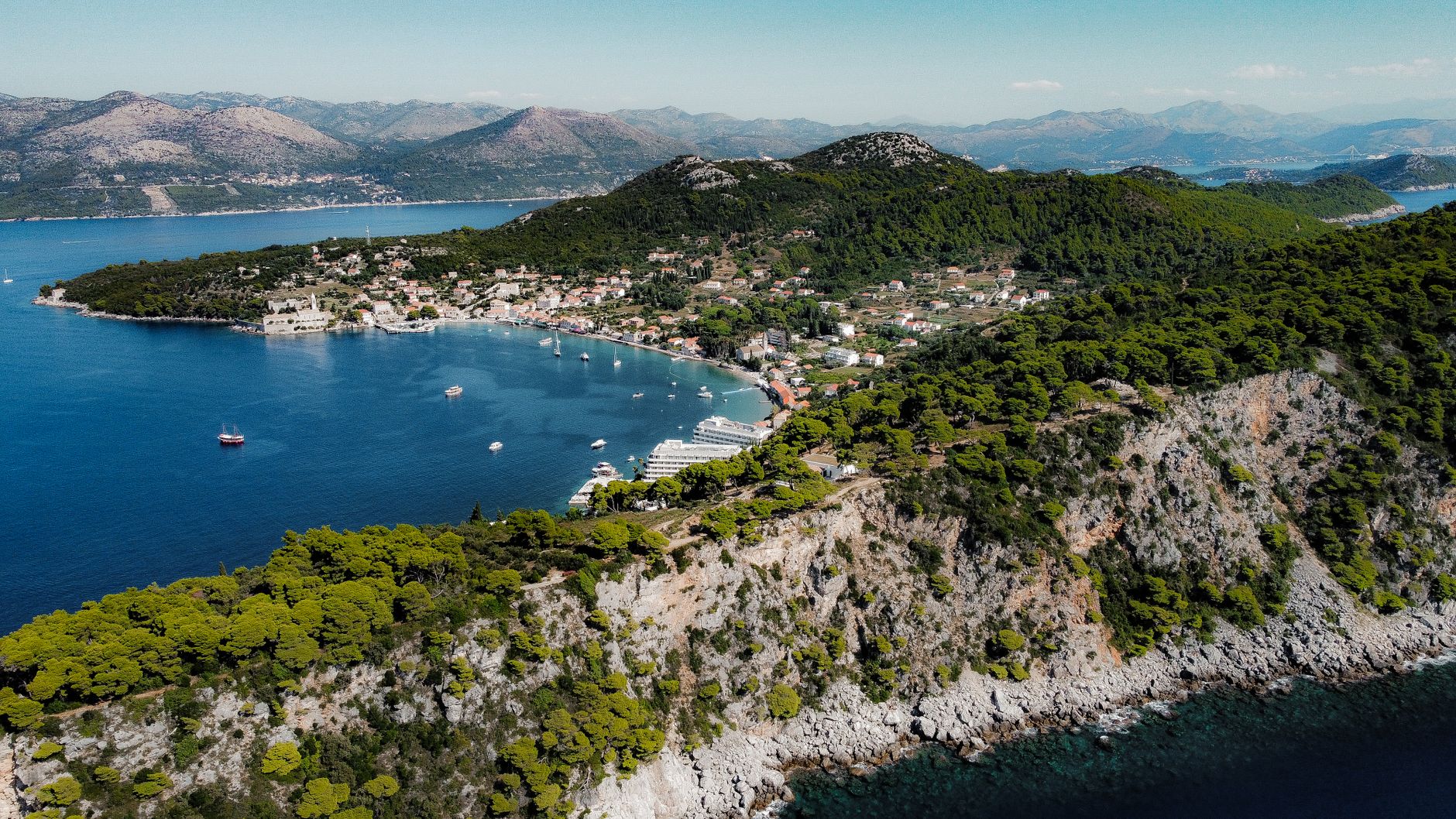 Šipan olive groves and stone farmhouse with the sea in the distance