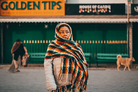 A vibrant street portrait of a warmly dressed woman in Darjeeling, West Bengal.