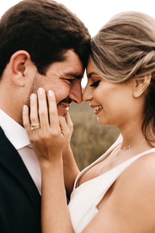 Free Close-up of a smiling couple embracing outdoors, capturing love and happiness. Stock Photo
