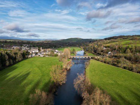 Stunning aerial shot of the village of Inistioge, showcasing lush landscapes and river views.